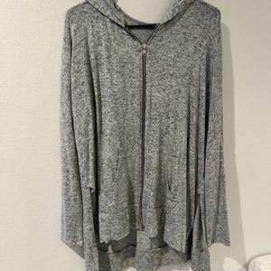 Grey zip up sweater with cutouts on side
